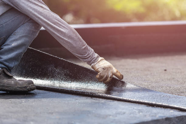Professional Basement Waterproofing technician working in Leslie, MI